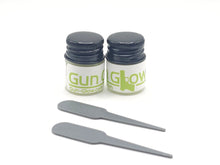 2 bottles of gun glow and stirring sticks
